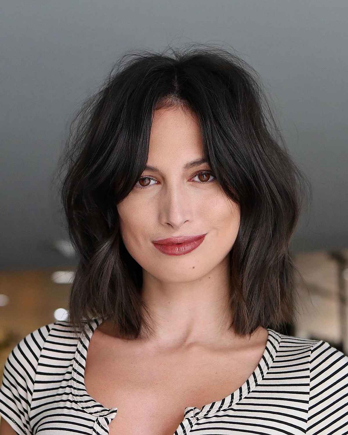 textured bob with a center part and long fringe