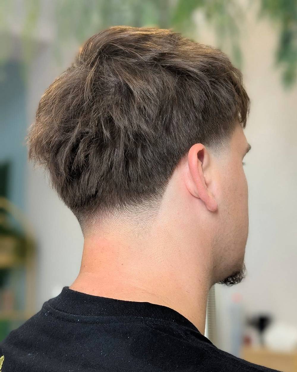 Textured crop with low taper fade, a clean and modern haircut for straight or wavy thick hair