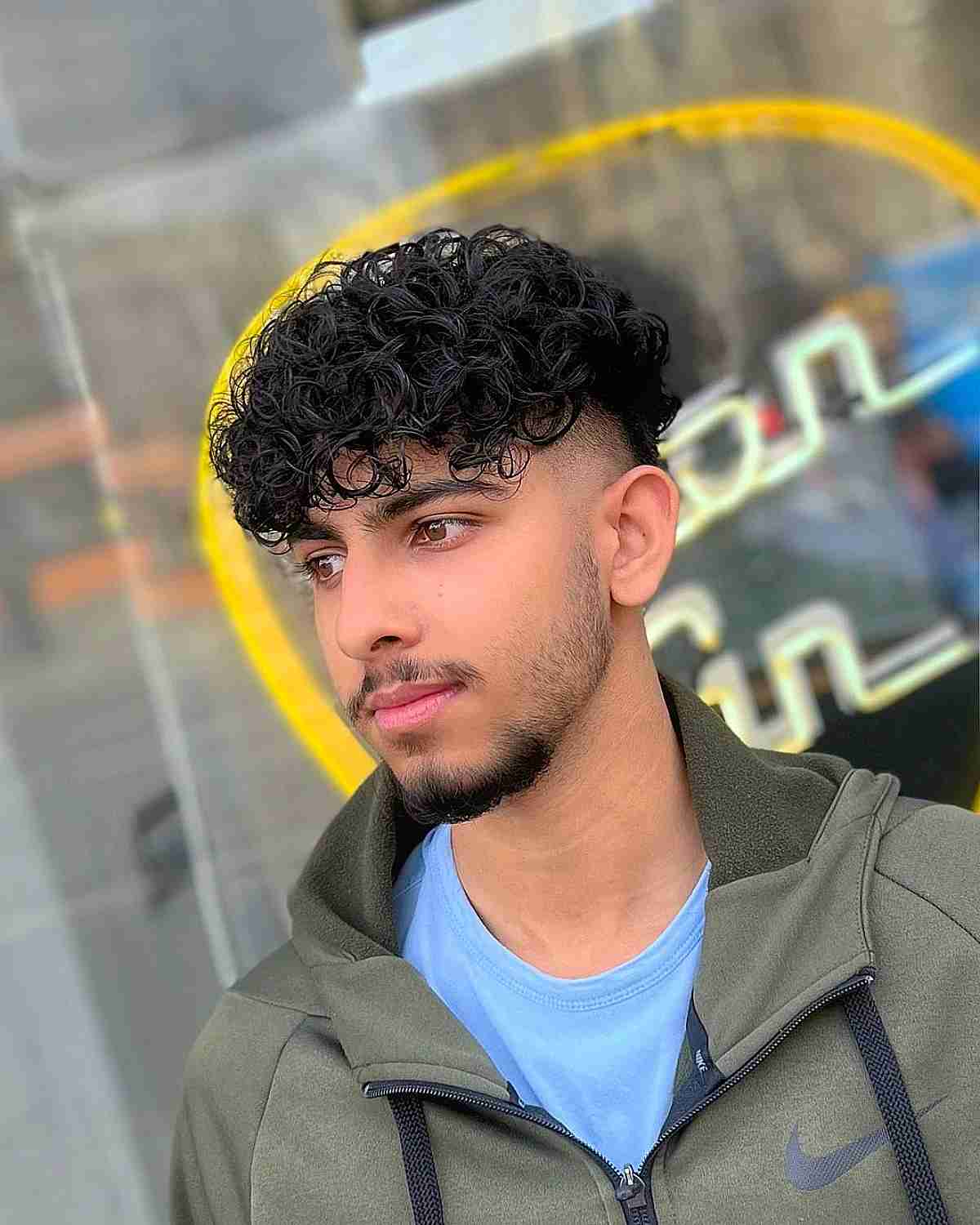 Textured Curls with Undercut and Fringe for Men