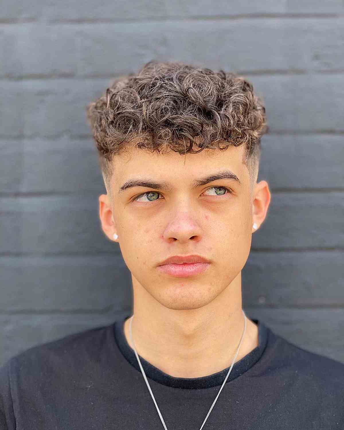 Textured Curly Hair with Sharp Faded Sides for Men