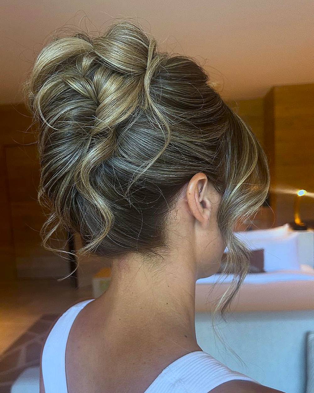 Textured French twist with loose waves, an elegant updo hairstyle for highlighted medium to thick hair