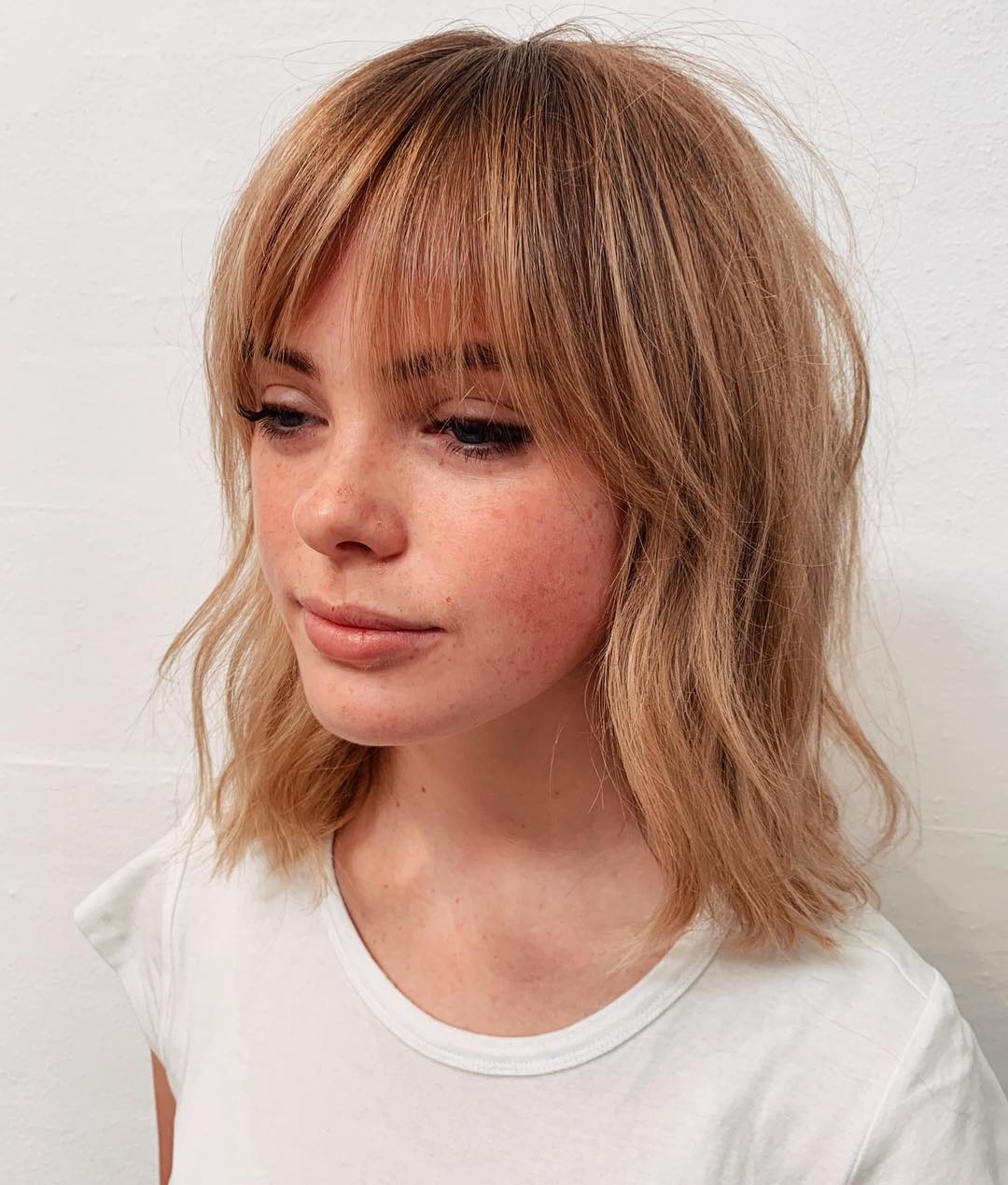 textured lob with bangs for thin hair