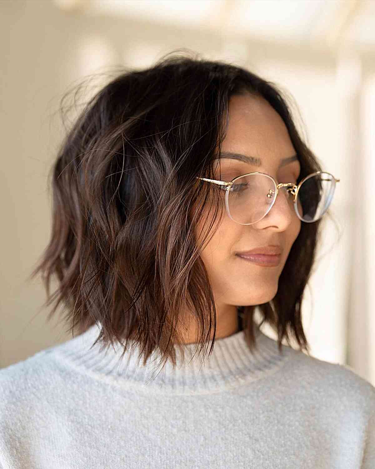 Textured Medium Bob with Wispy Layers and Middle Part Style