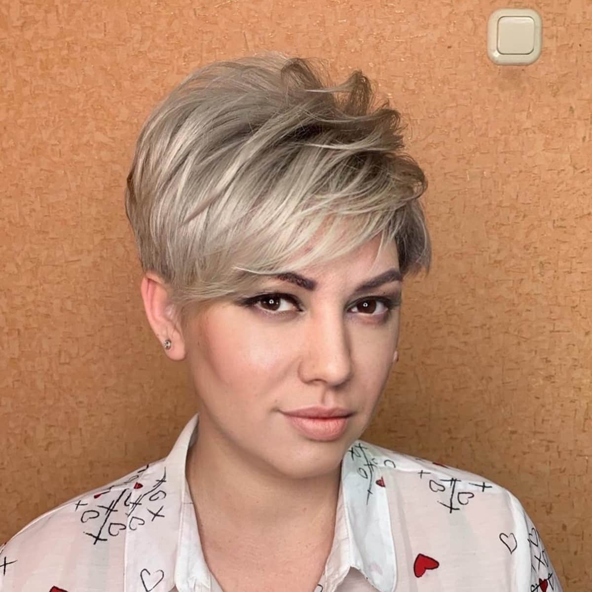 Textured pixie in a tousled hairdo for oval faces