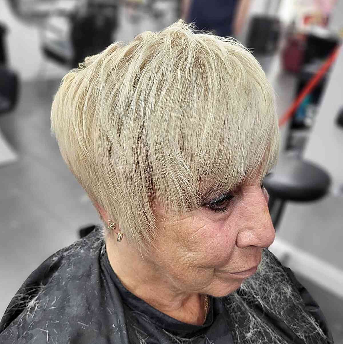 Cheek-length Textured Pixie with Choppy Layers and Bangs for 60-year-olds