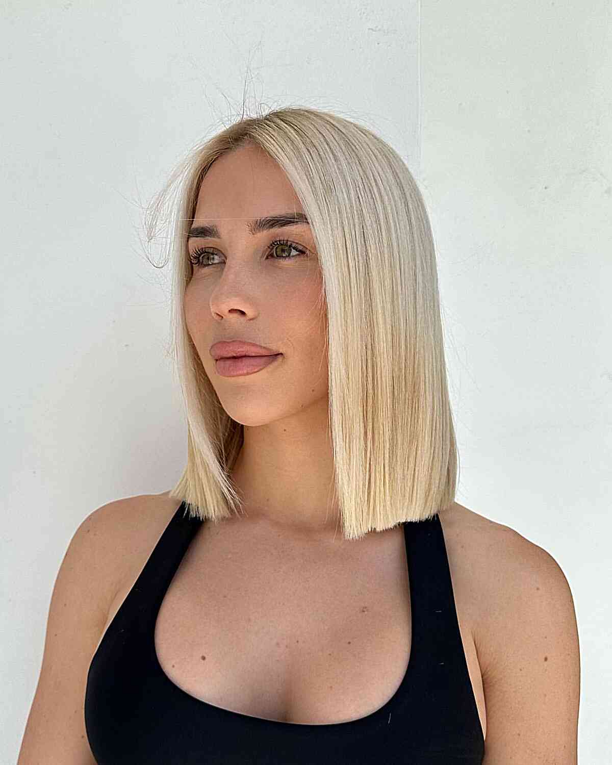 The Bluntest Long Bob for ladies with blonde straight hair