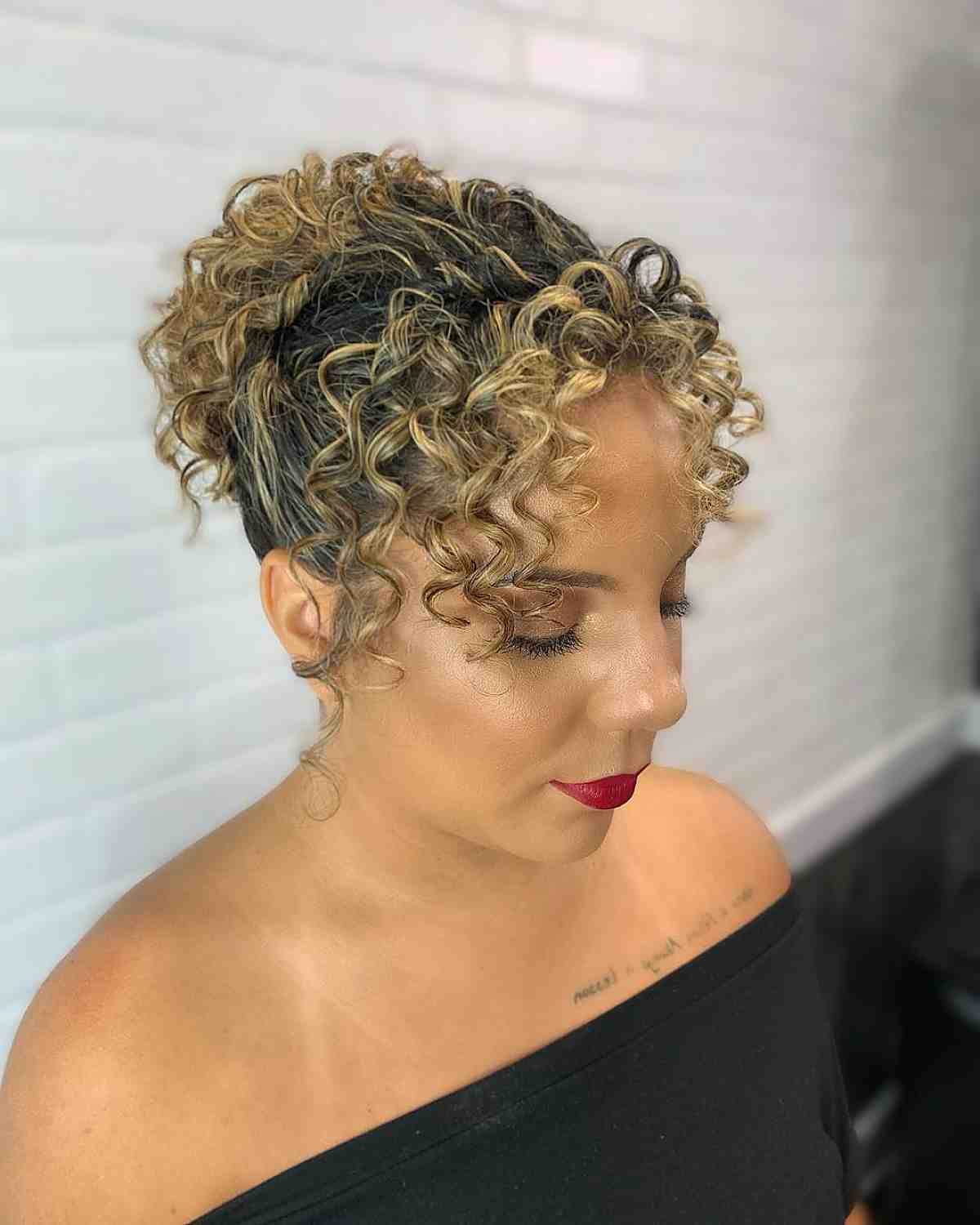 Curly updo with curtain bangs for prom