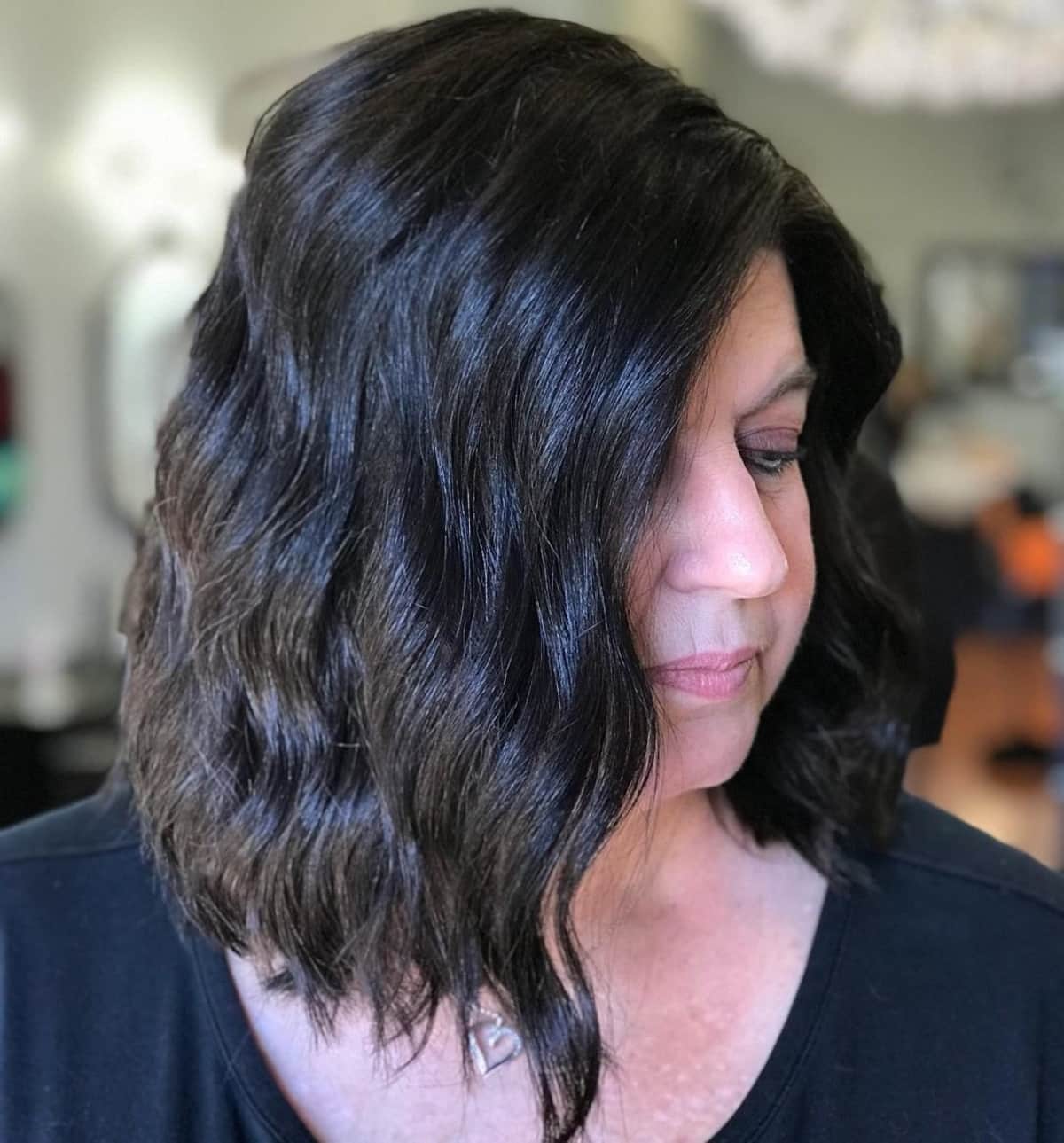The mid stacked bob for women past their 50s with wavy hair