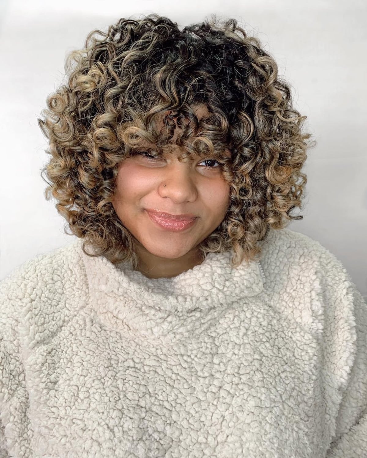 33 Best Short Curly Hair with Bangs to Try This Year