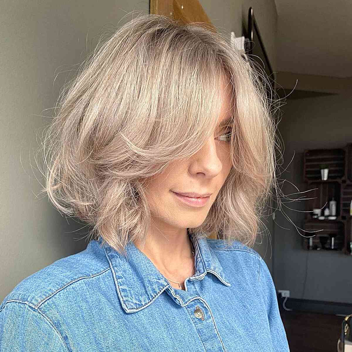 Thick Choppy Bob with Long Curtain Bangs and Angled Layers for Denser Hair Type