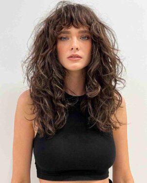 32 Ways to Pair Wavy Hair with Bangs for a Super-Flattering Look