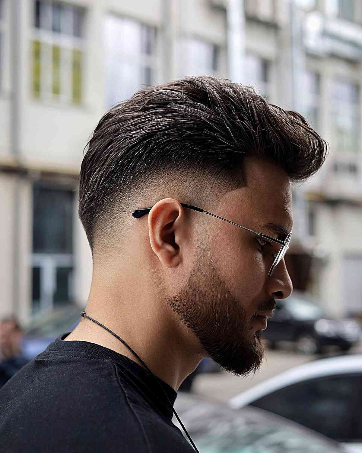 A mid-fade haircut for men with thick hair