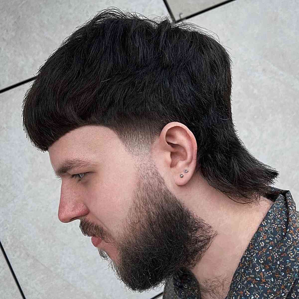 Thick Mullet with a Beard Fade for Guys
