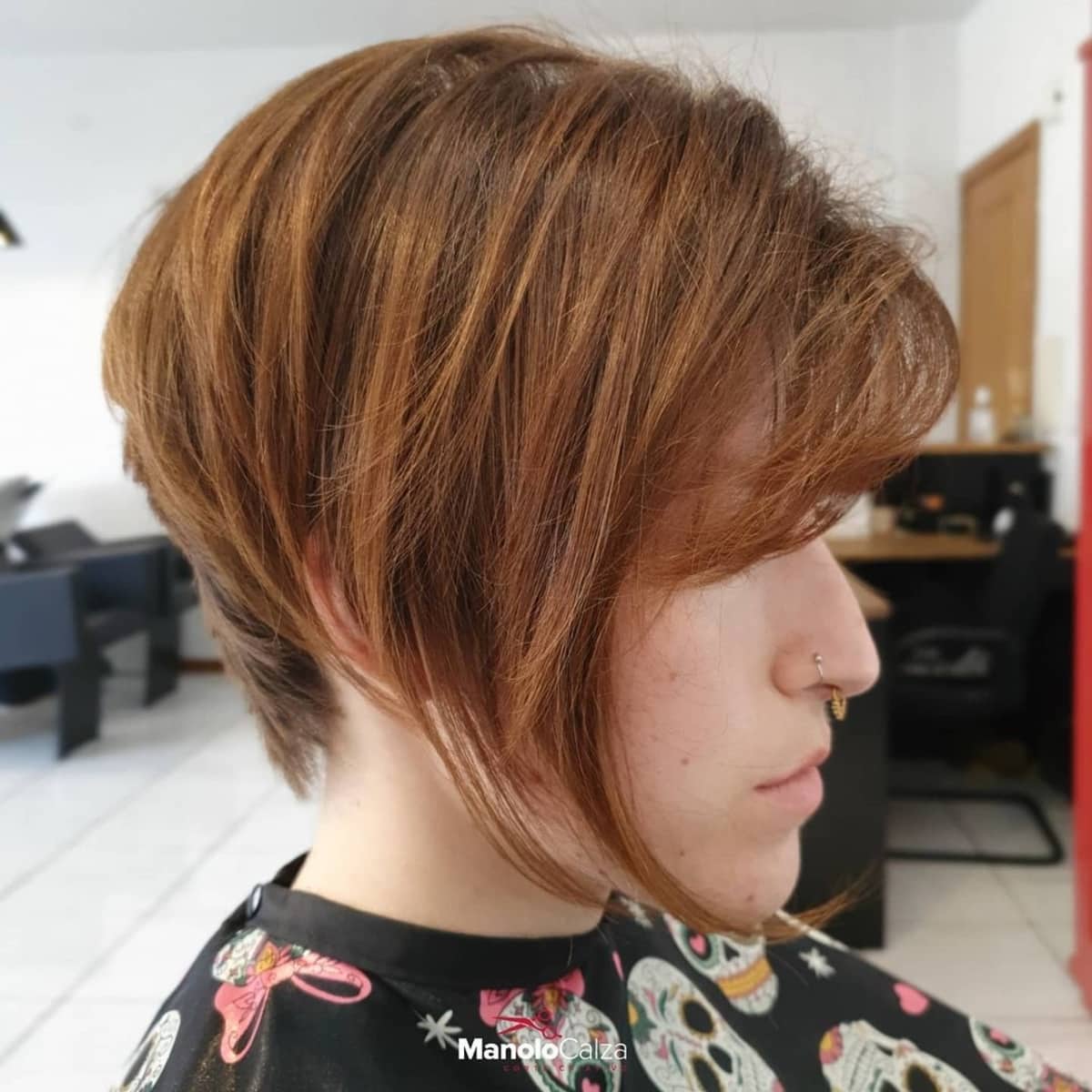 Thick pixie bob with medium to long layers and side bangs