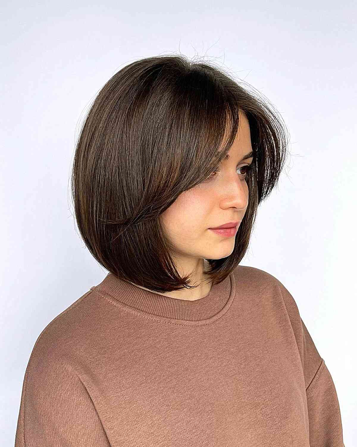 Neck-Length Thick Round Bob with Face-Framing Bangs