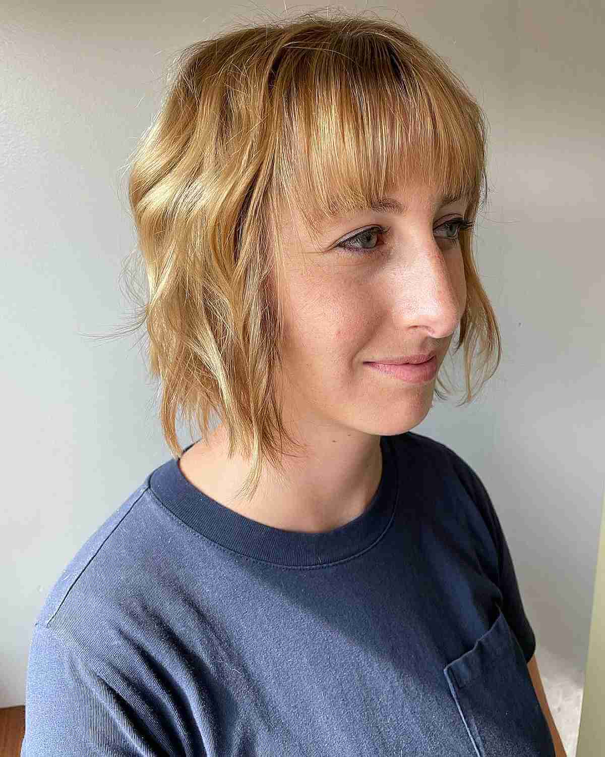 Thinning Tousled Bob with Beach Waves and Straight Bangs