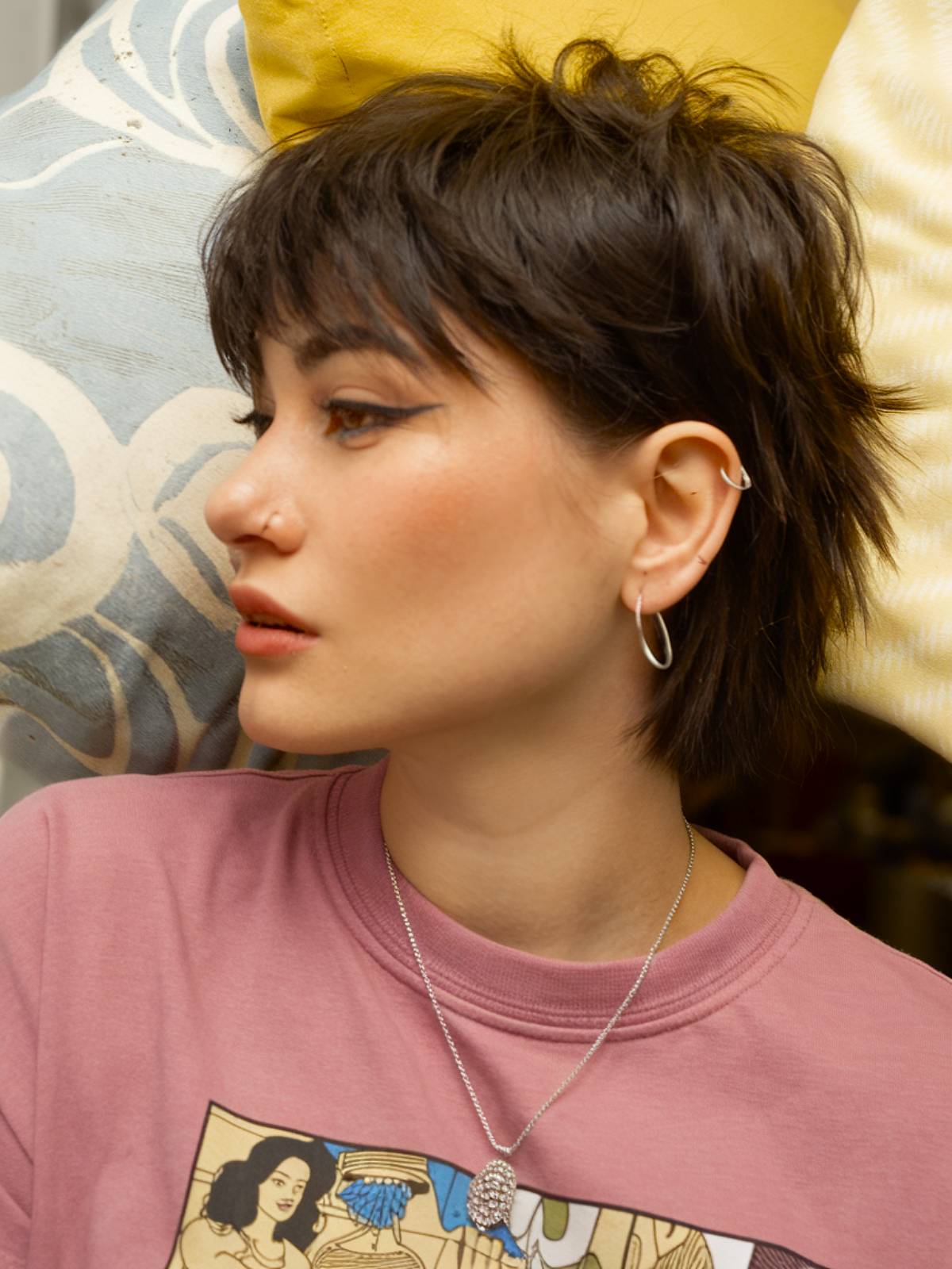 Tomboy mullet with textured choppiness and short, edgy layers for a bold, effortless style