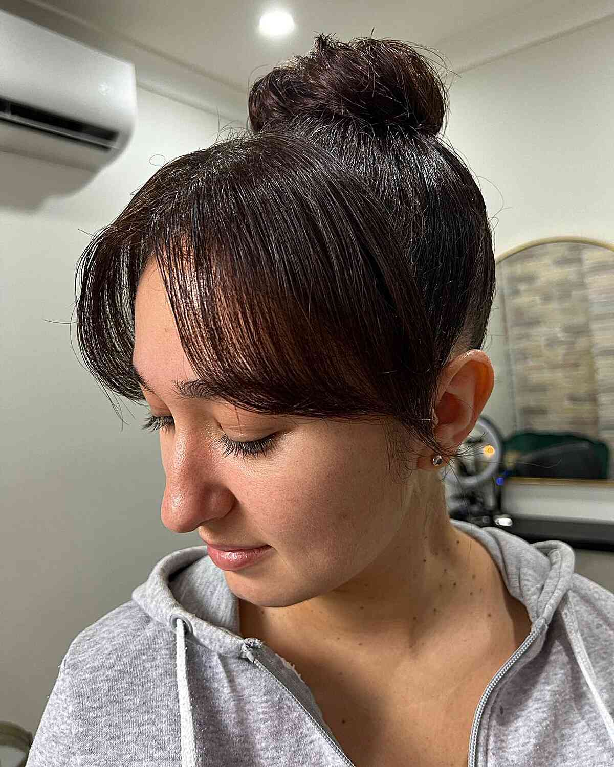 Top Knot Bun Updo with Middle Part Bangs