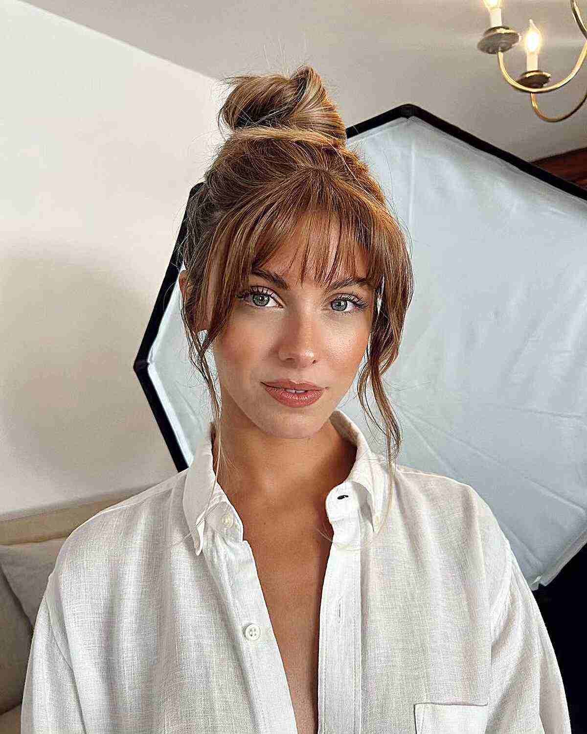 Top Knot Loose Updo with Face-Framing Bangs