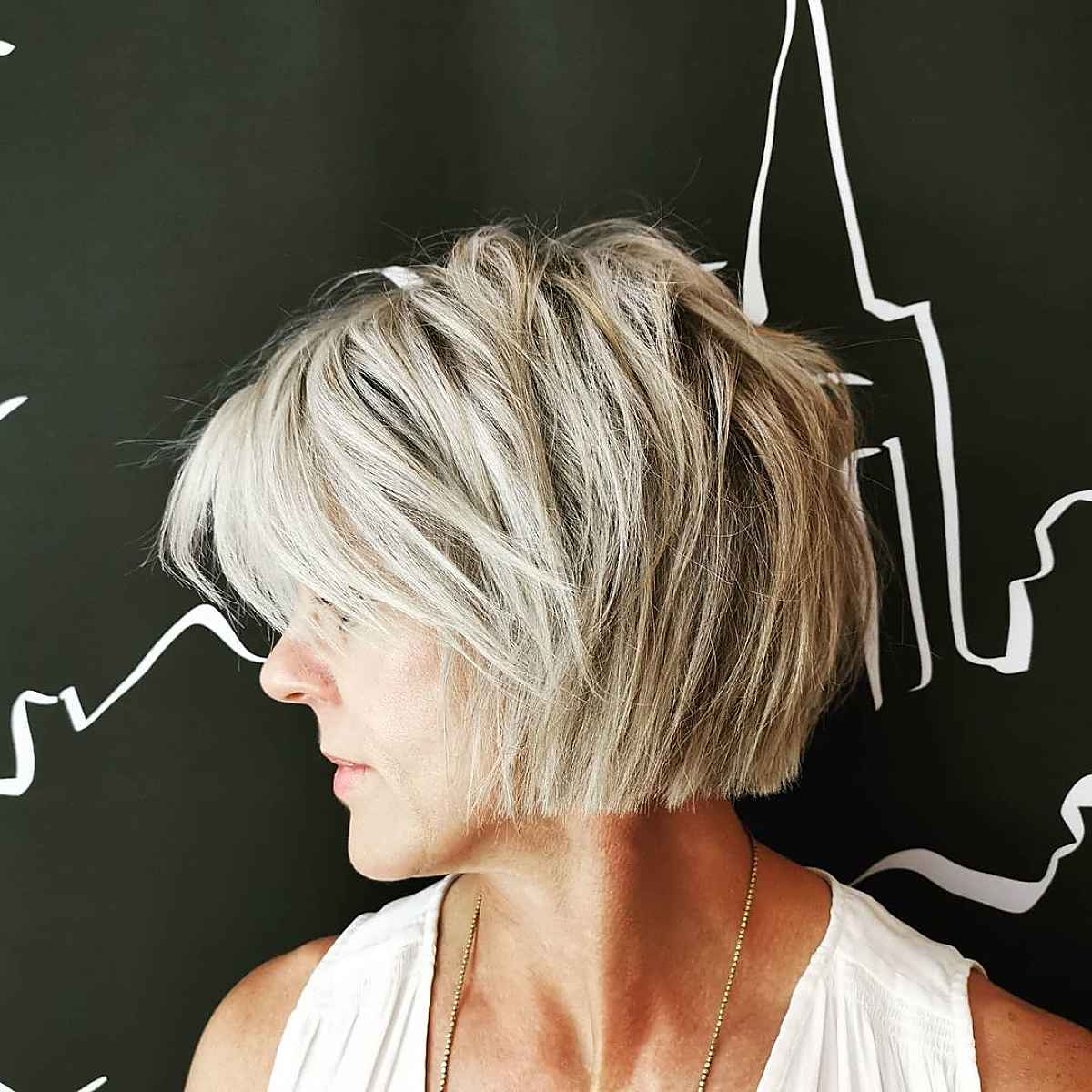 tousled blunt cut with bangs