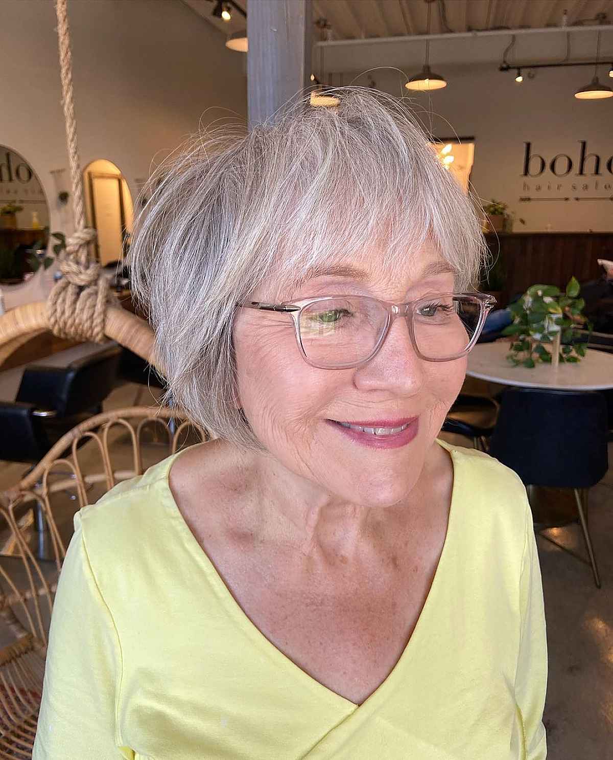tousled bob with bangs for women over 60 with glasses