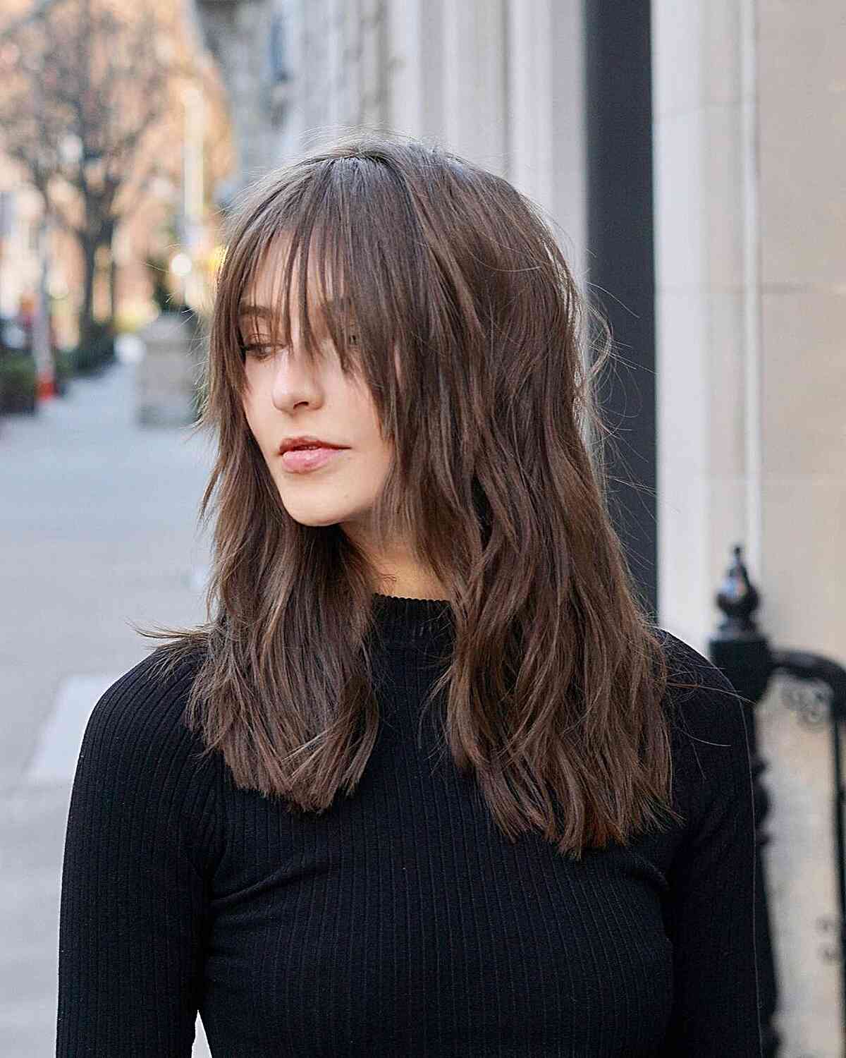 Mid-length Tousled Choppy Haircut with waterfall Fringe