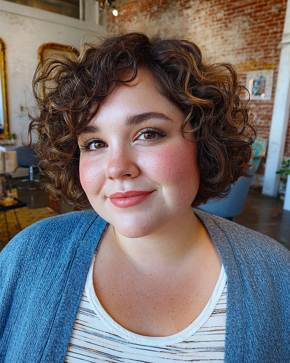 Tousled curly bob with volume on thick short hair, perfect short bob hairstyle for round faces and natural curls