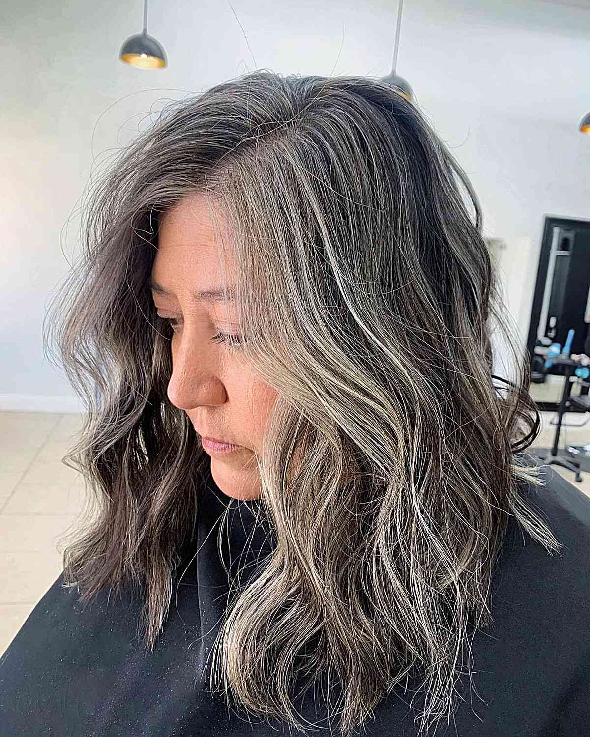 Medium Tousled Dark Hair with Grey Blended Money Piece 