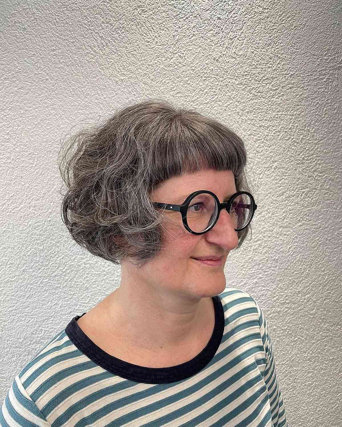 Tousled Ear-Length Cut with Short Bangs for 60-Year-Old Women