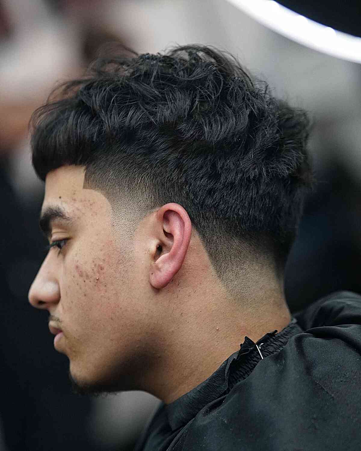 Tousled Edgar Style with Low Drop Fade on Men's Dense Hair