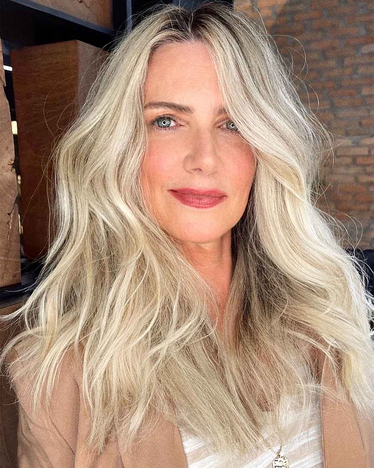 Tousled Hairstyle with a Middle Part for a Woman Over 40 with Fine Hair