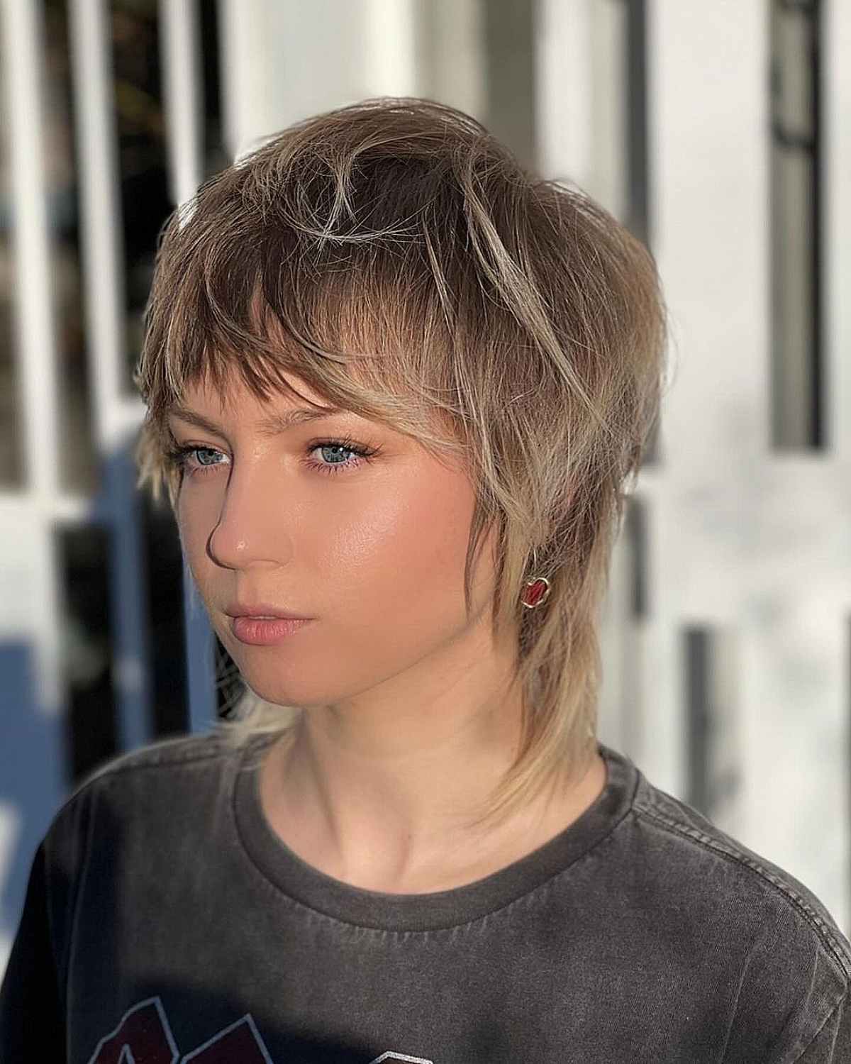 Tousled mullet with soft layers and textured fringe on fine to medium hair