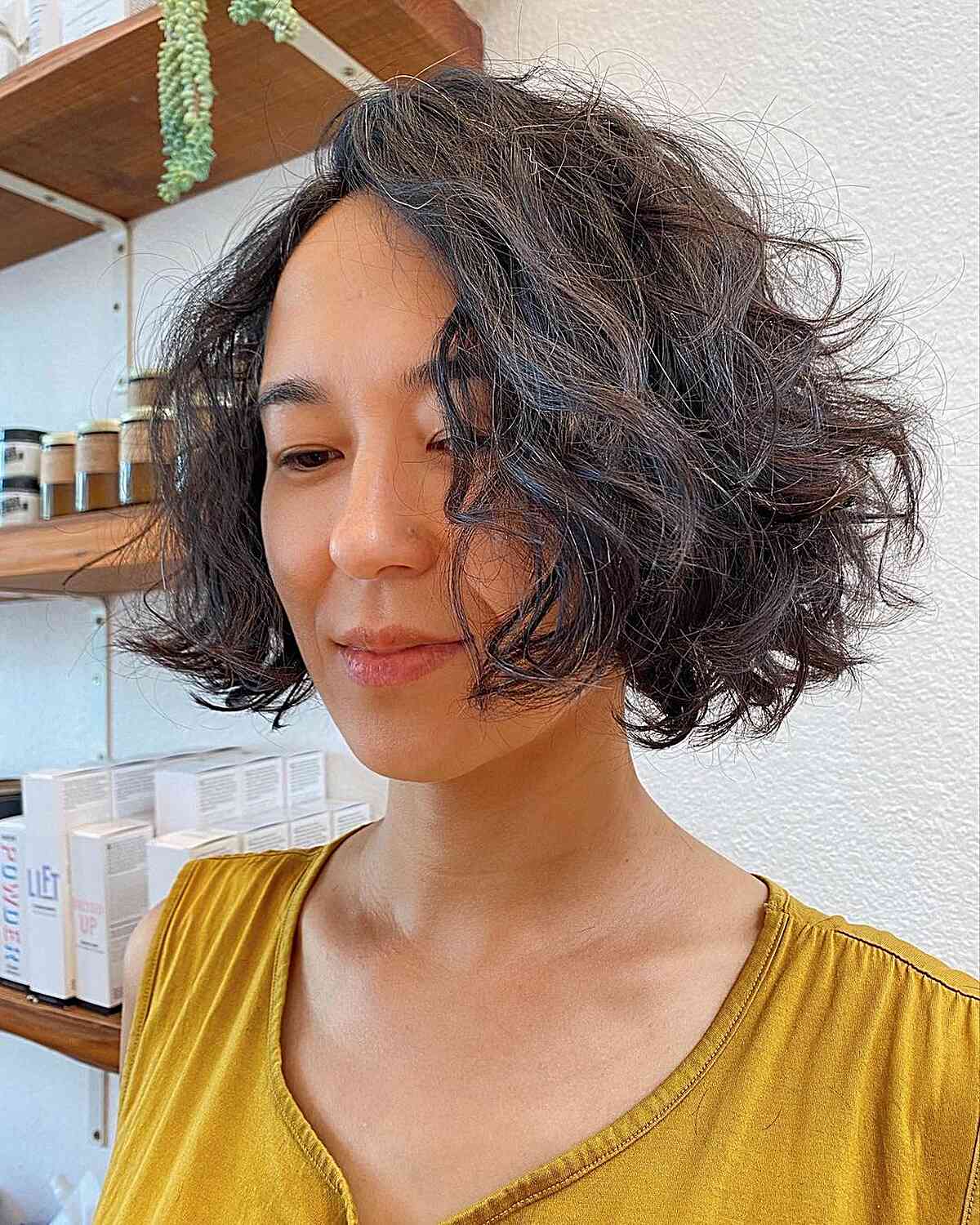 Tousled Razored Wavy Bob with Side Part