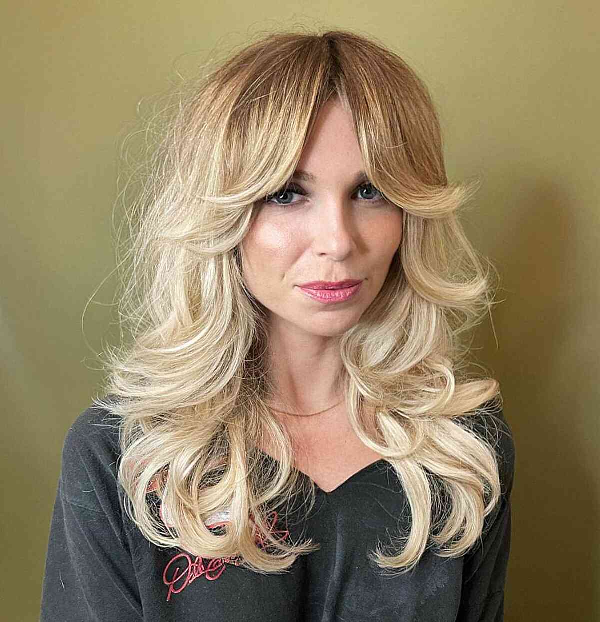 Trendy Blonde Shag with Curtain Fringe and Curled Ends