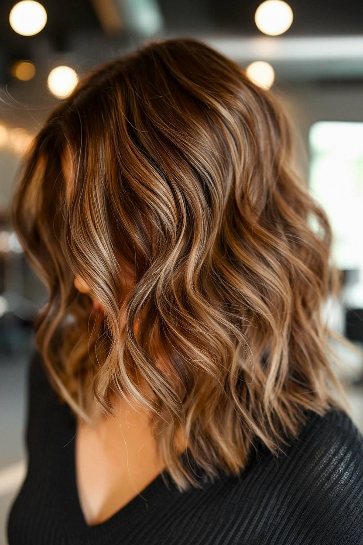 Caramel balayage on medium-length brunette hair