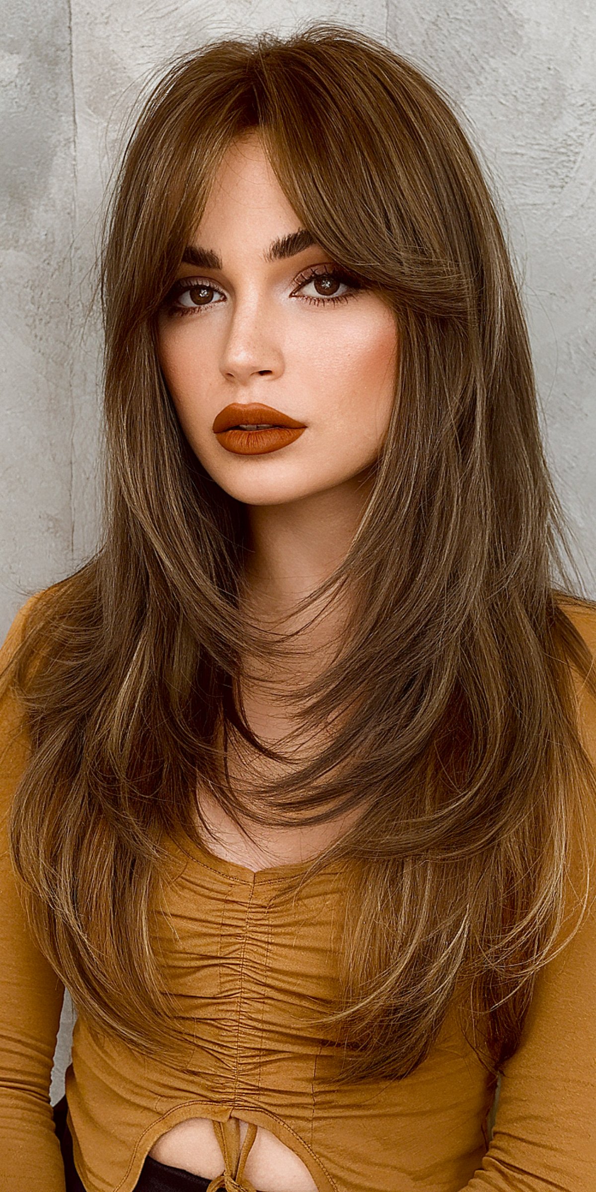 Trendy long straight hair with curtain bangs hairstyle