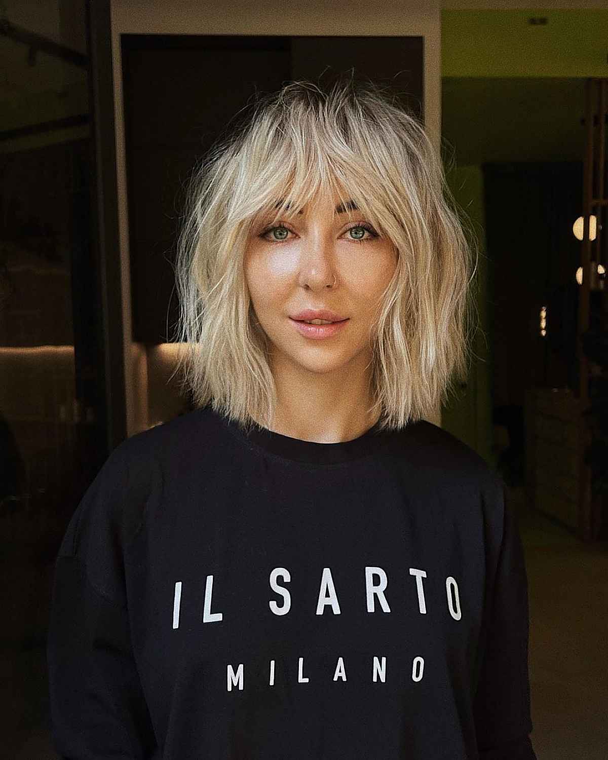 trendy messy bob hairstyle with dark roots