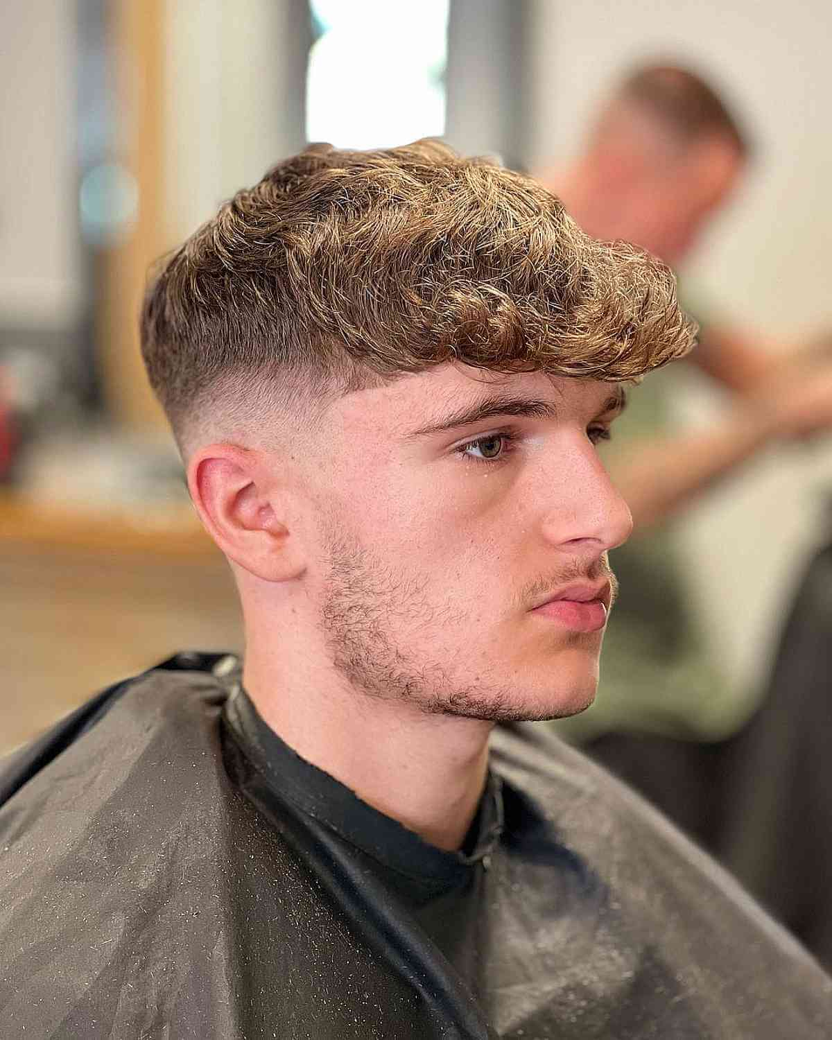 Trendy Mid Fade with a Curly Thick Top for Men