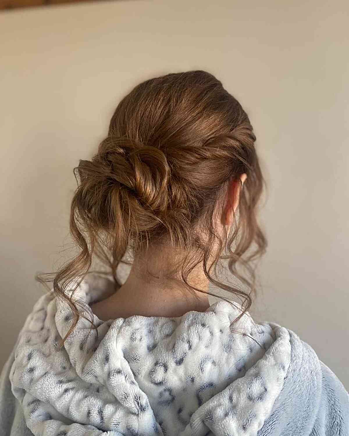 Messy Twisted Updo with Loose Strands for Girls' Graduation