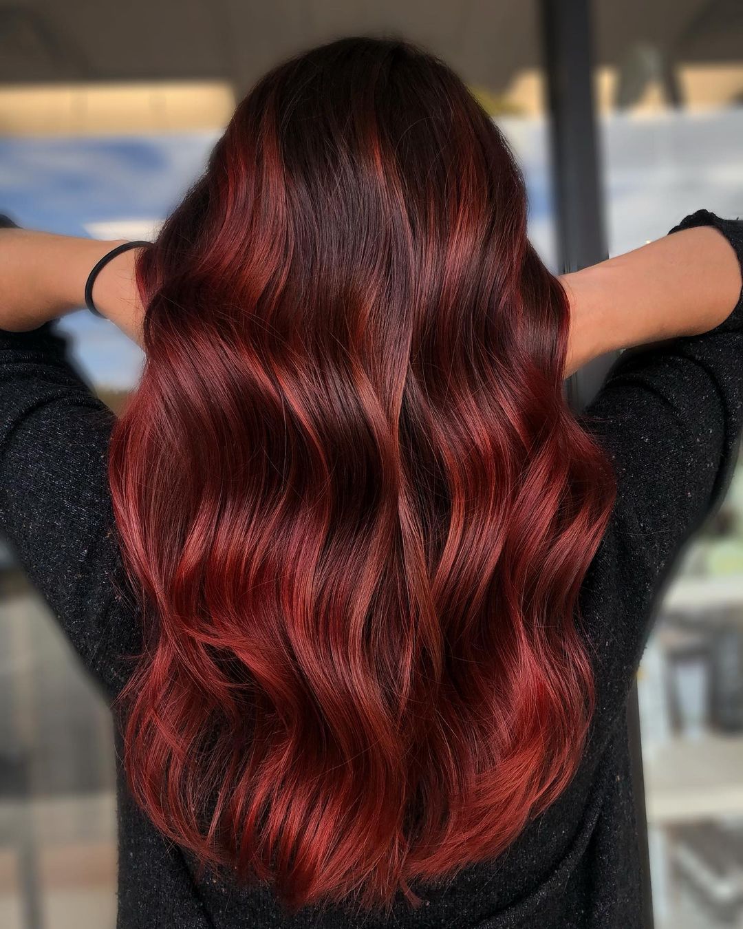 two-tone black and red hair color in balayage