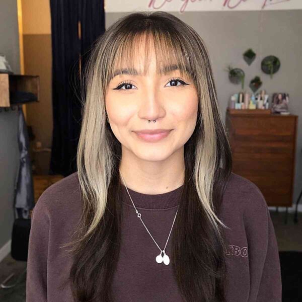 A Two-Toned Layered Cut with See-Through Bangs on Round Faces with Prominent Cheekbones