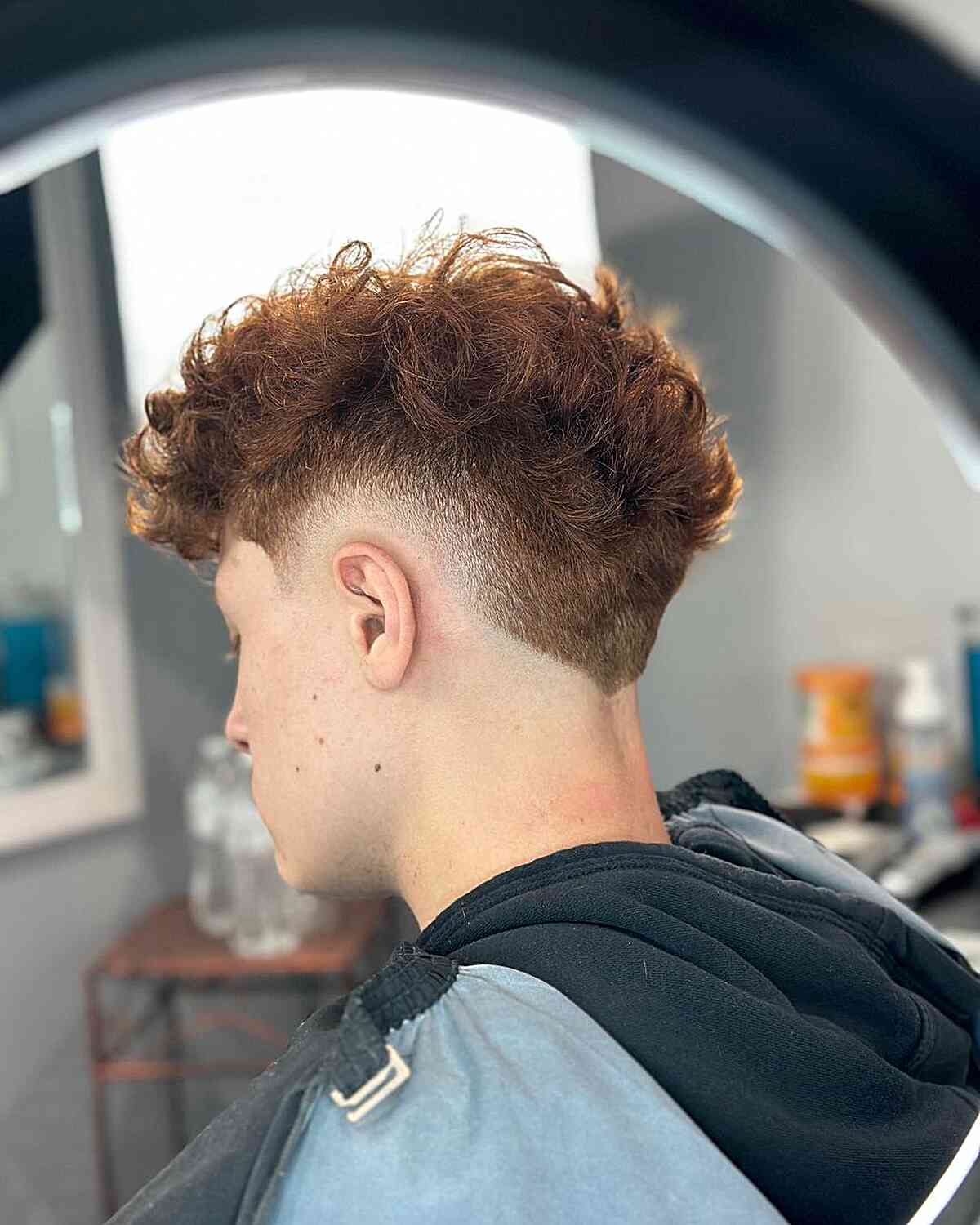 Undercut + Burst Fade for Guys with curly hair
