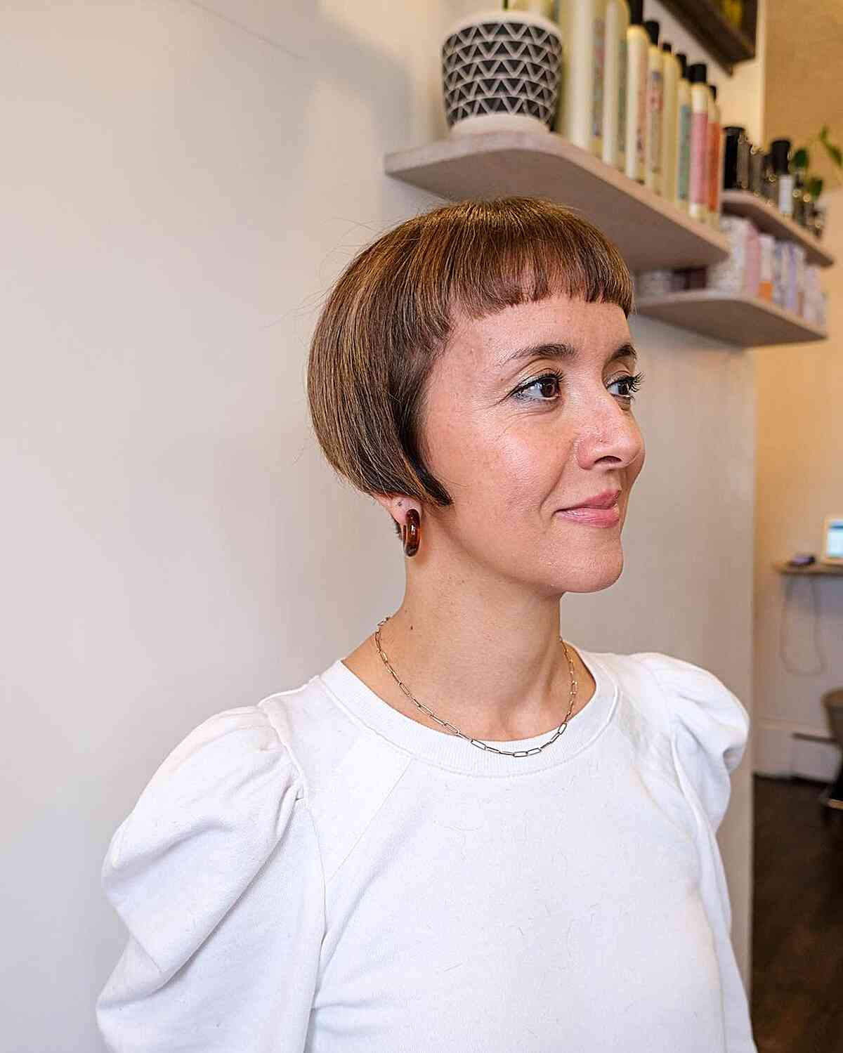 Undercut Ear-Length Bob with blunt fringe for women with longer faces