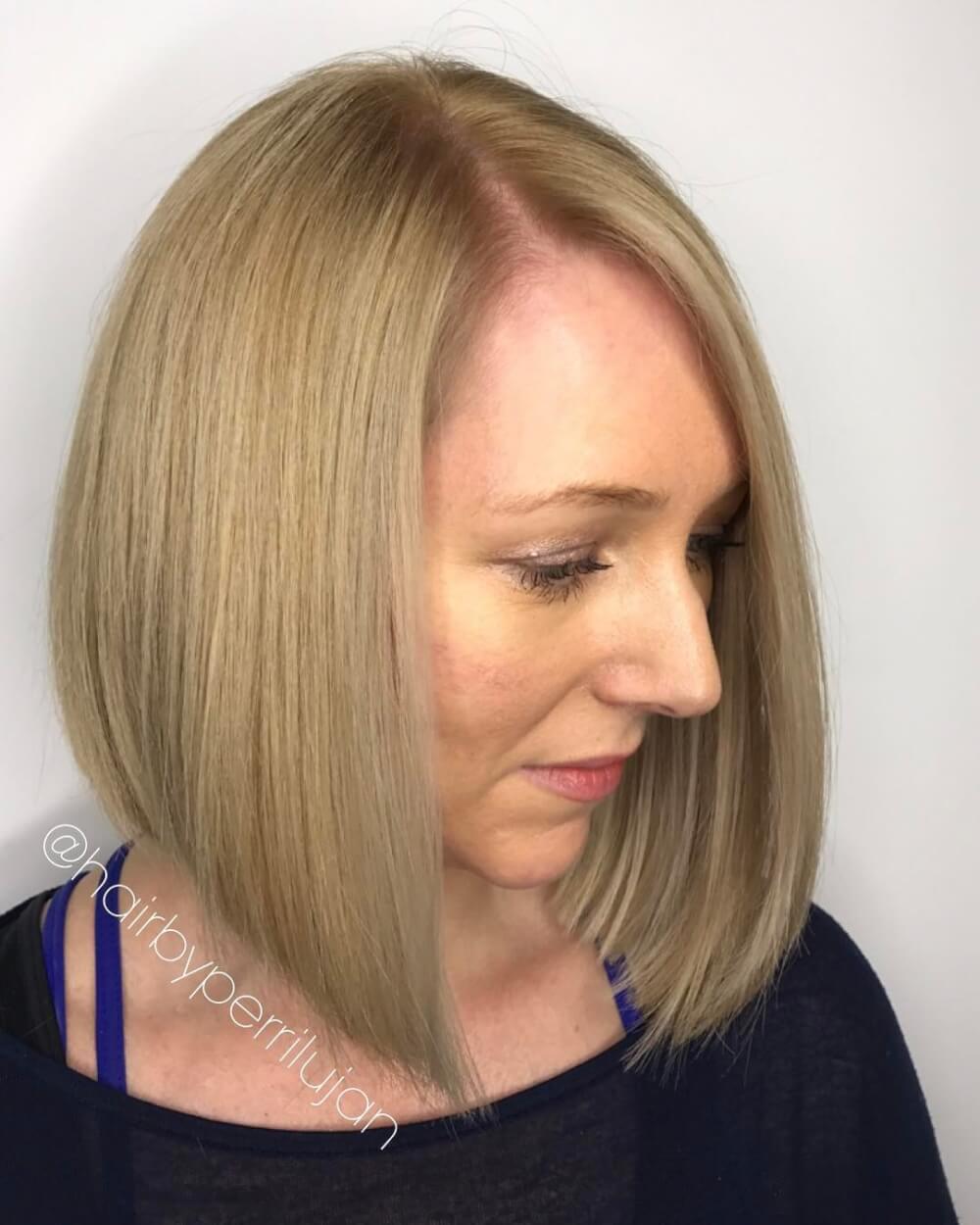 A short to long bob haircut with a side part
