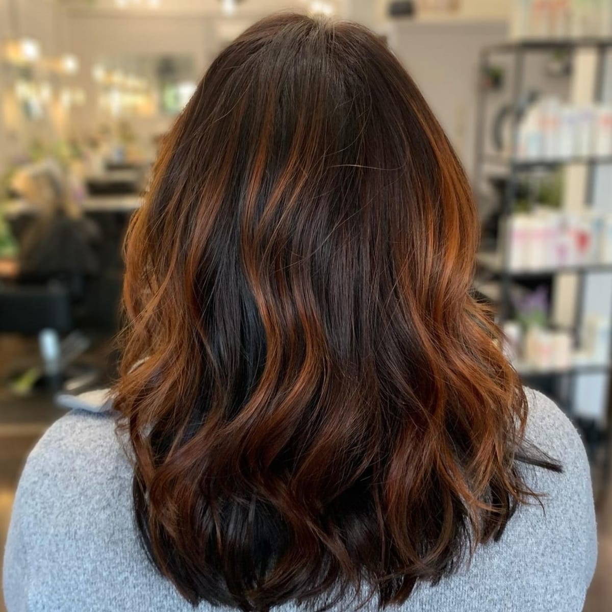 Very dark hair with copper highlights