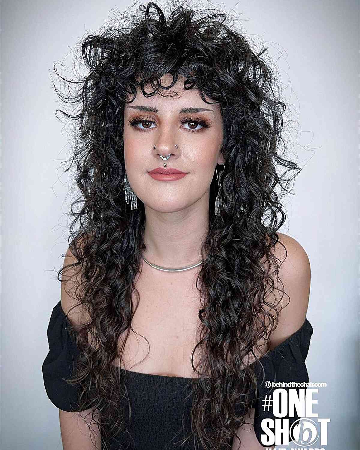 Very Long Curly Layered Hair with Curly Bangs on Women with Oval Face Shape