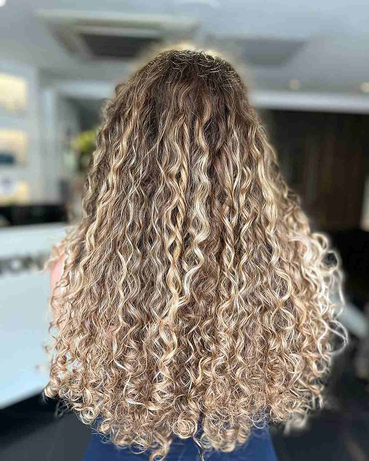 Very Long Sandy Blonde Balayage Curly Hair