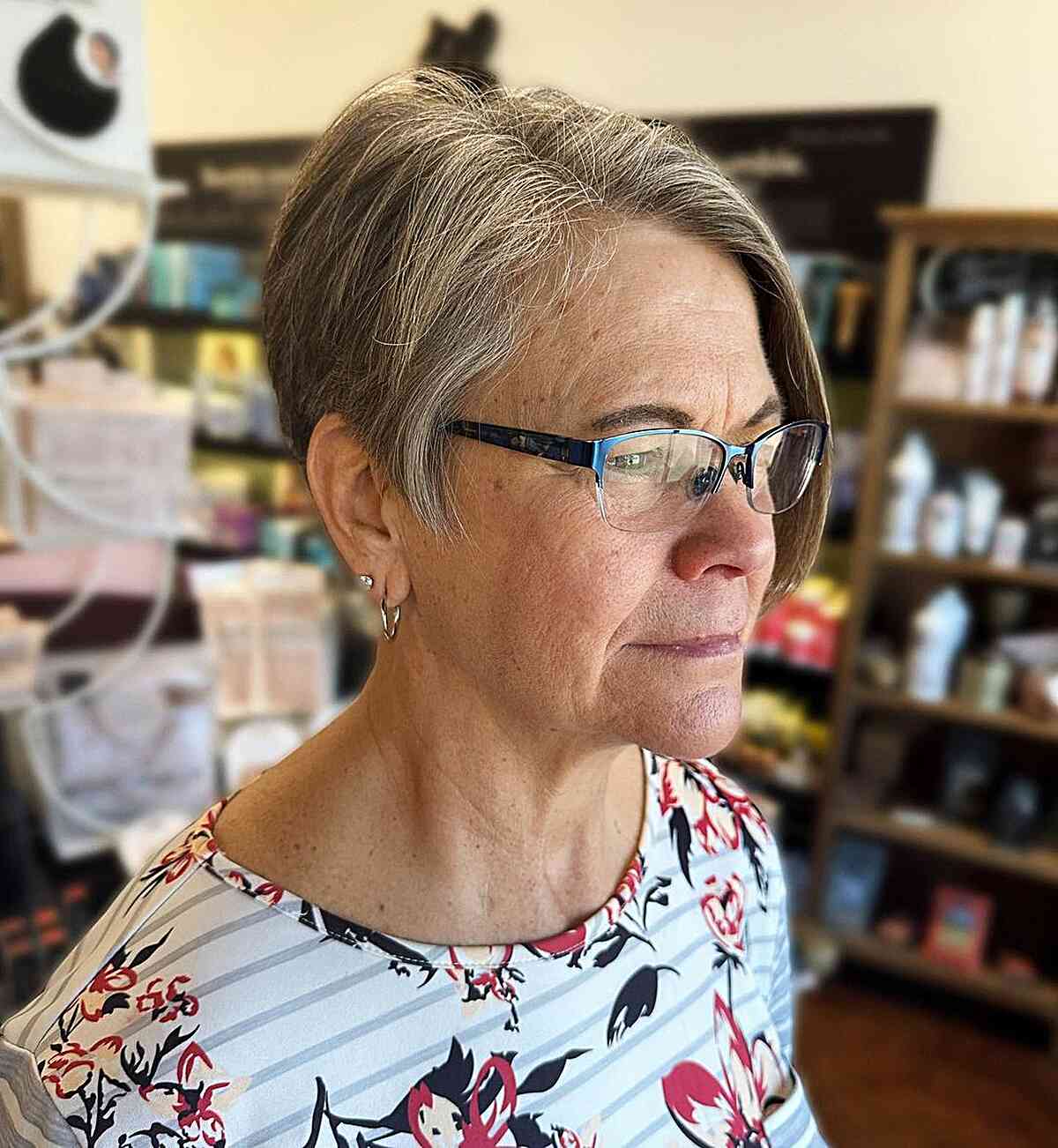 Very Short Asymmetrical Haircut for women aged 60 with reading glasses