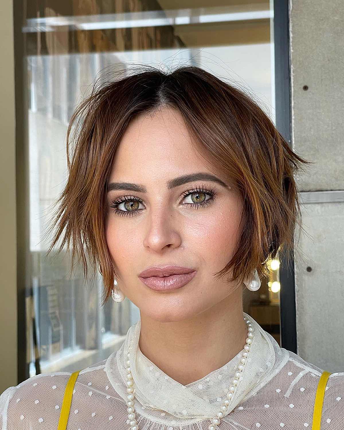 very short bob with a center part