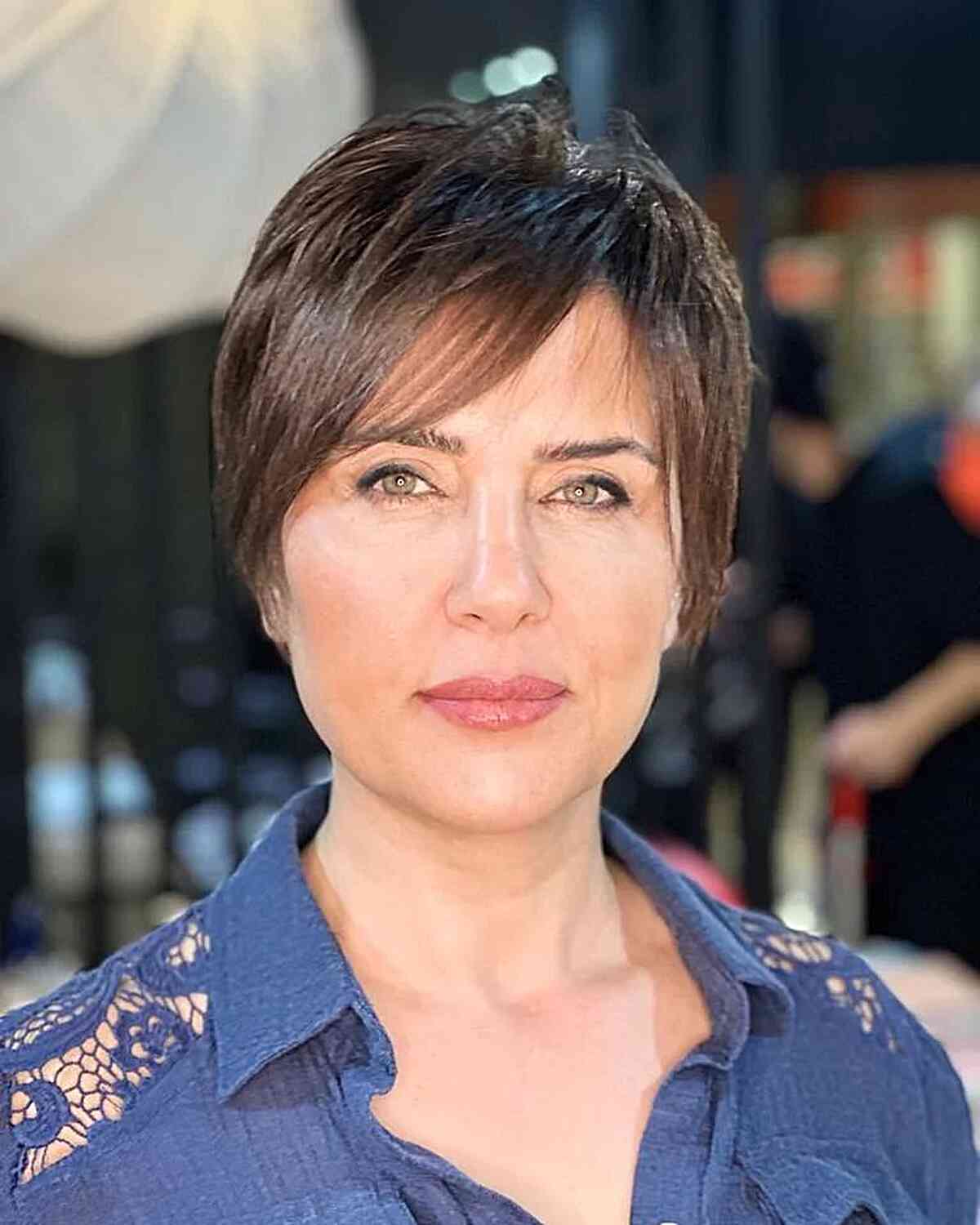 Very Short Hair with Sweeping Bangs for women with oval faces